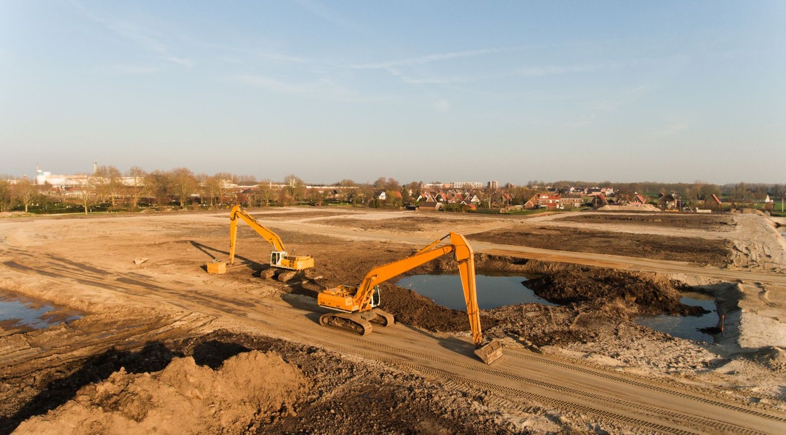 https://sunfixconsulting.com/wp-content/uploads/2025/08/high-angle-shot-two-excavators-building-site.jpg